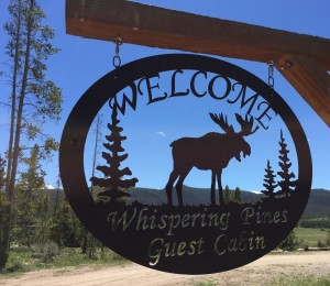 Whispering Pines Guest Cabin Welcome Sign